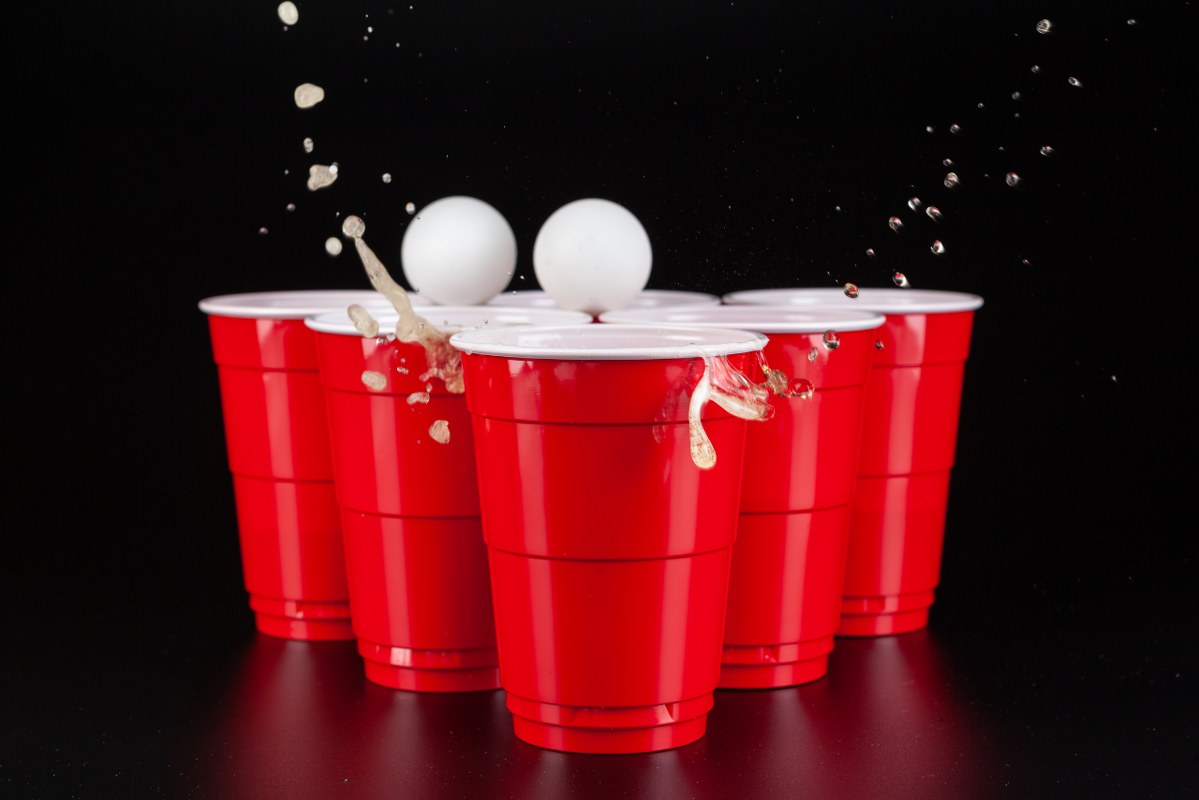The arrangement of red plastic cups for game of beer pong.