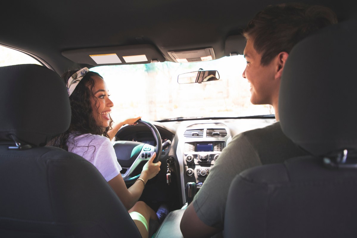 Two young adults ride sharing.