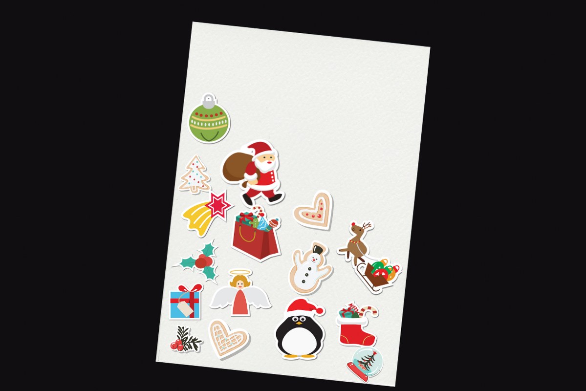 Various christmas stickers on paper.