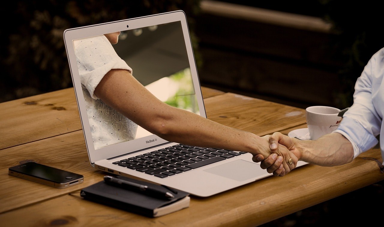 Virtual buyer and seller shaking hands.