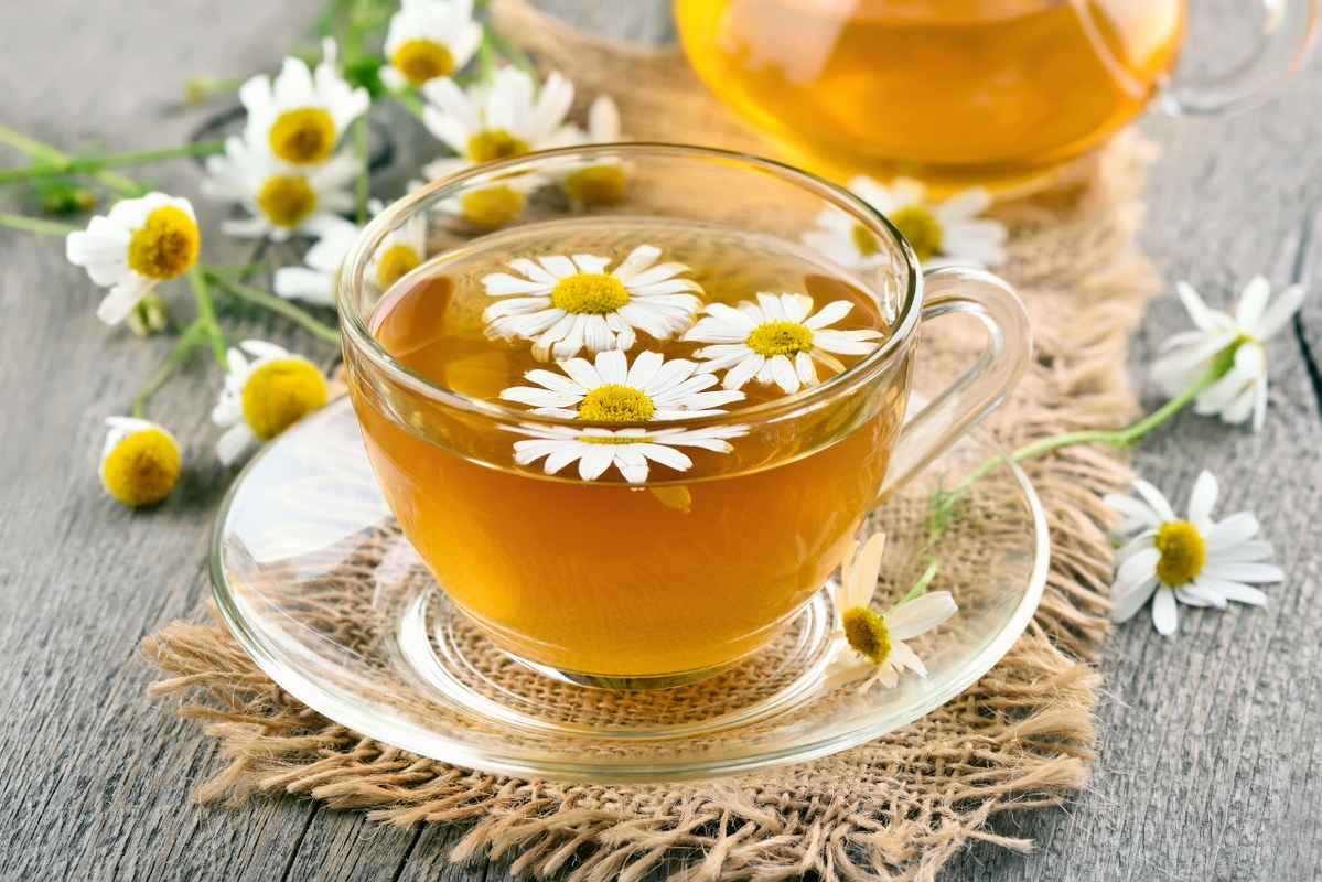 White tea with decorative flowers floating.