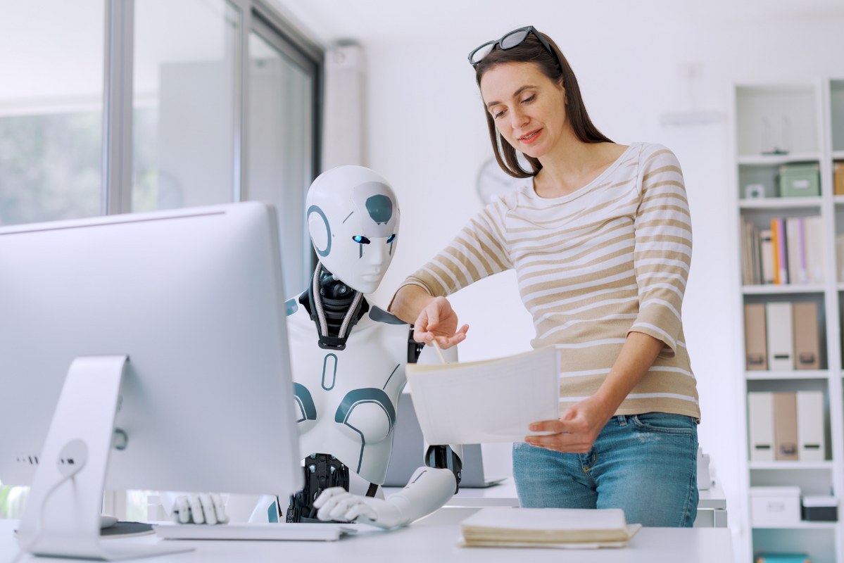 Woman and AI robot working together.