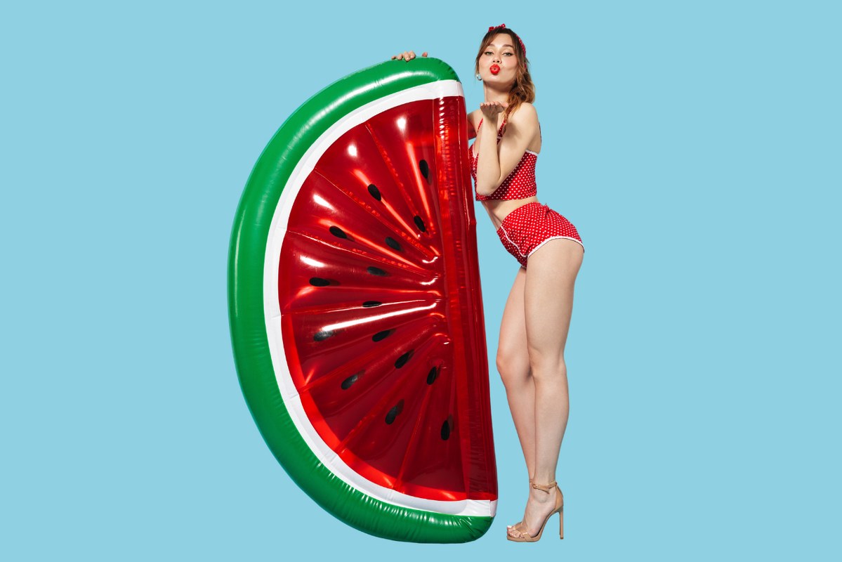 Woman in Bikini with Watermelon giant Floatie.