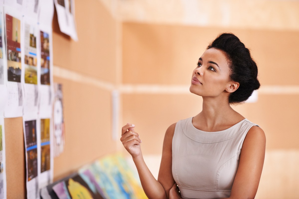Woman keeps eyes on well-designed business plan.