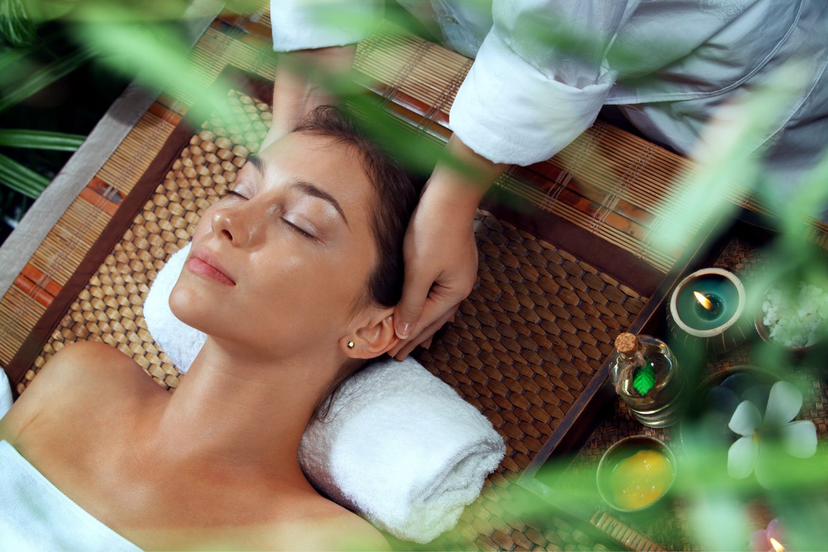 Woman relaxing in spa environment.