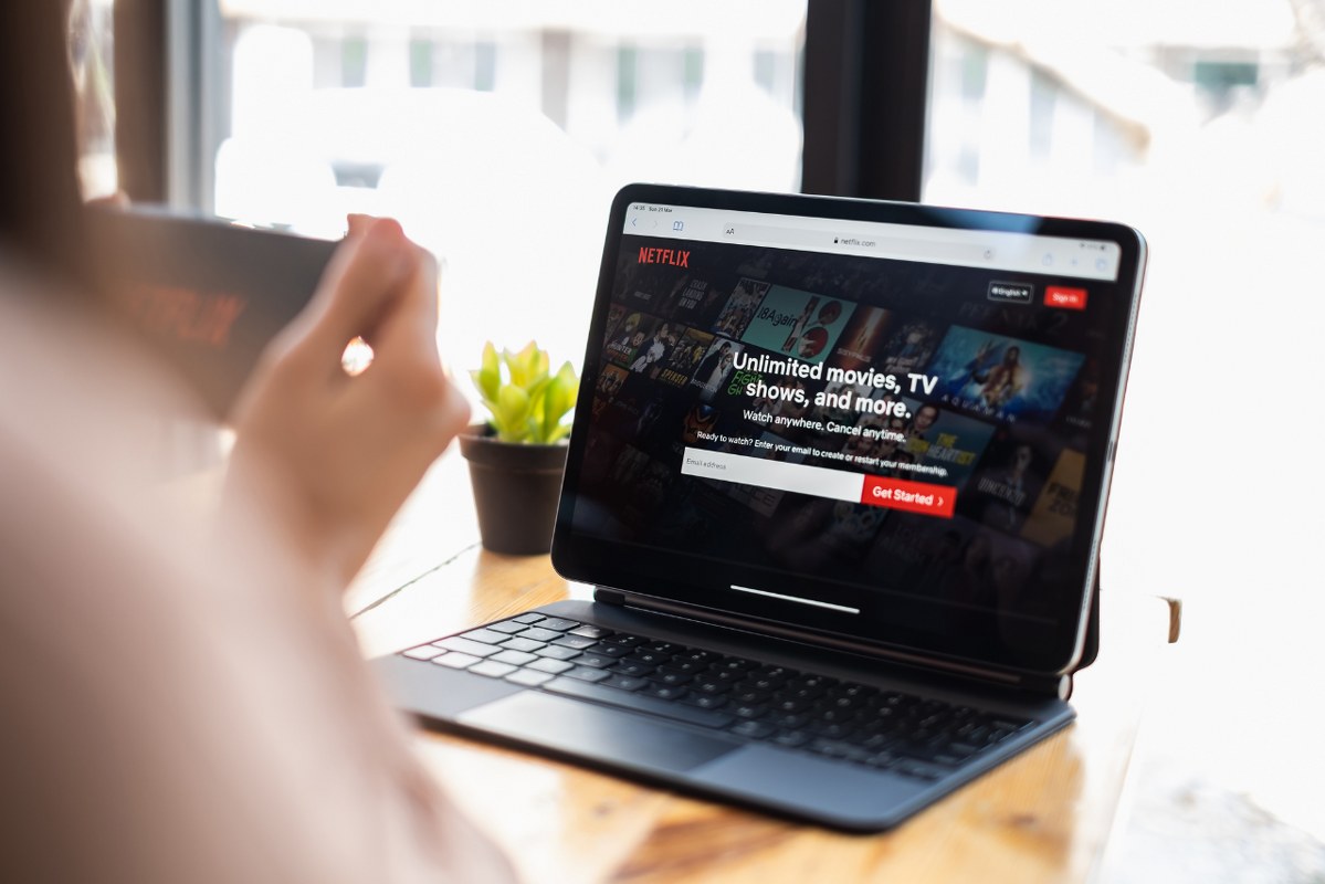 Woman watching Netflix on laptop.