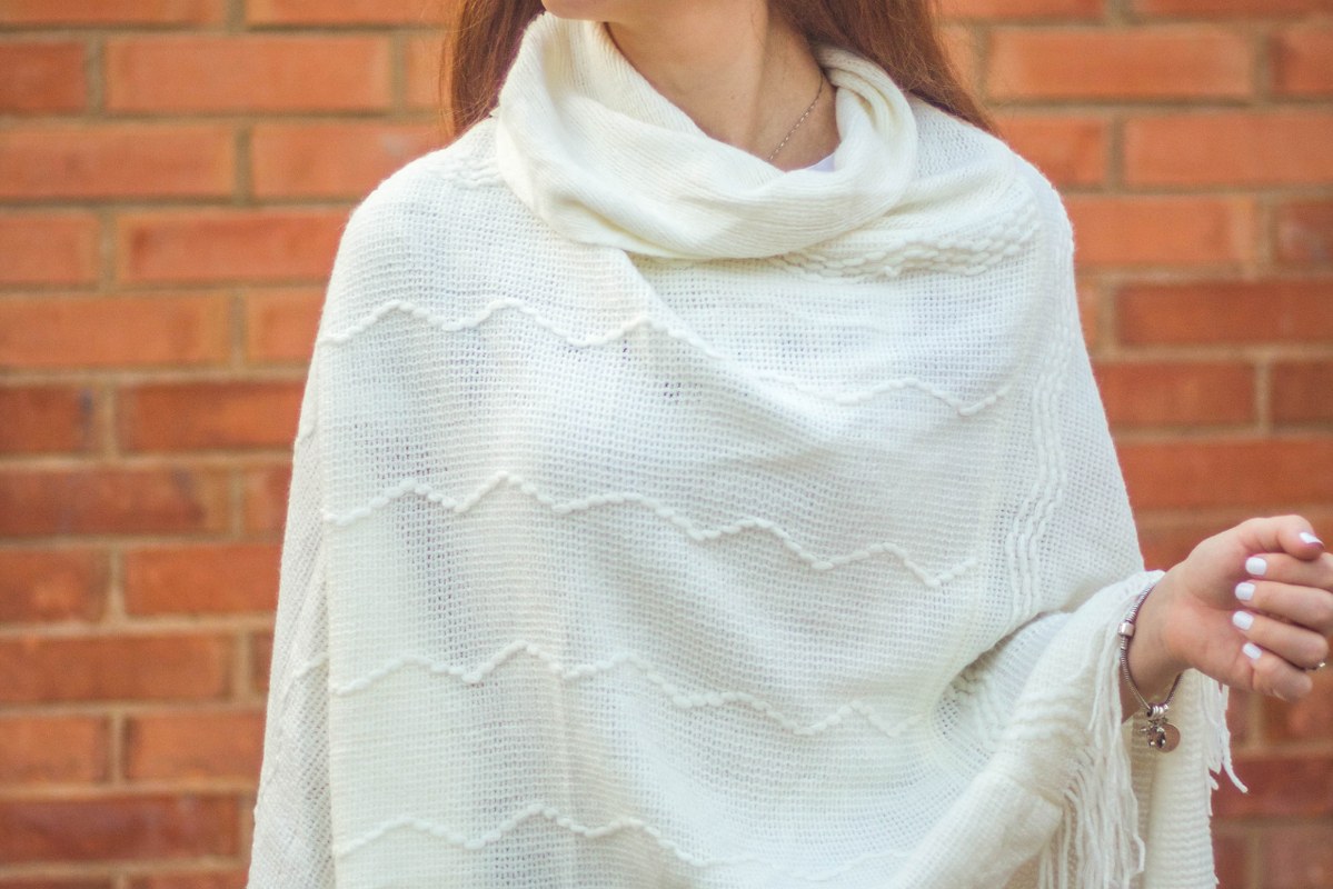 Woman wearing shawl.