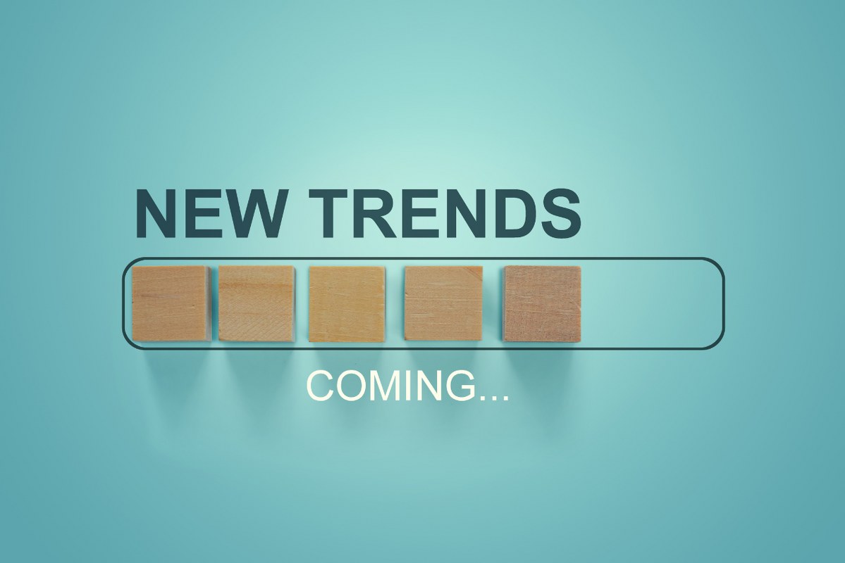 Wooden blocks with the word NEW TRENDS coming in loading bar progress.