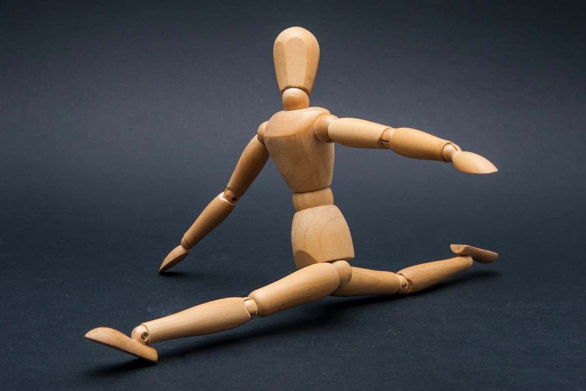 Wooden human figure showing flexibility.