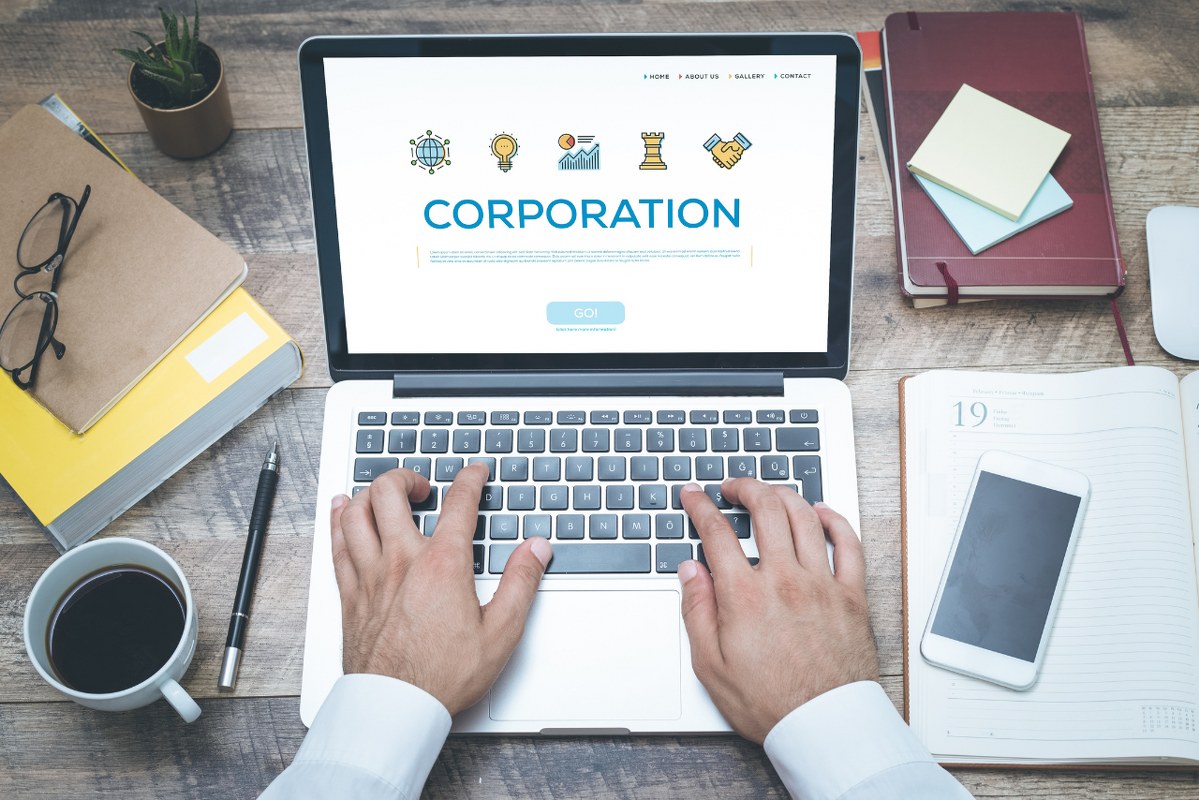 Word Corporation shown on laptop screen.