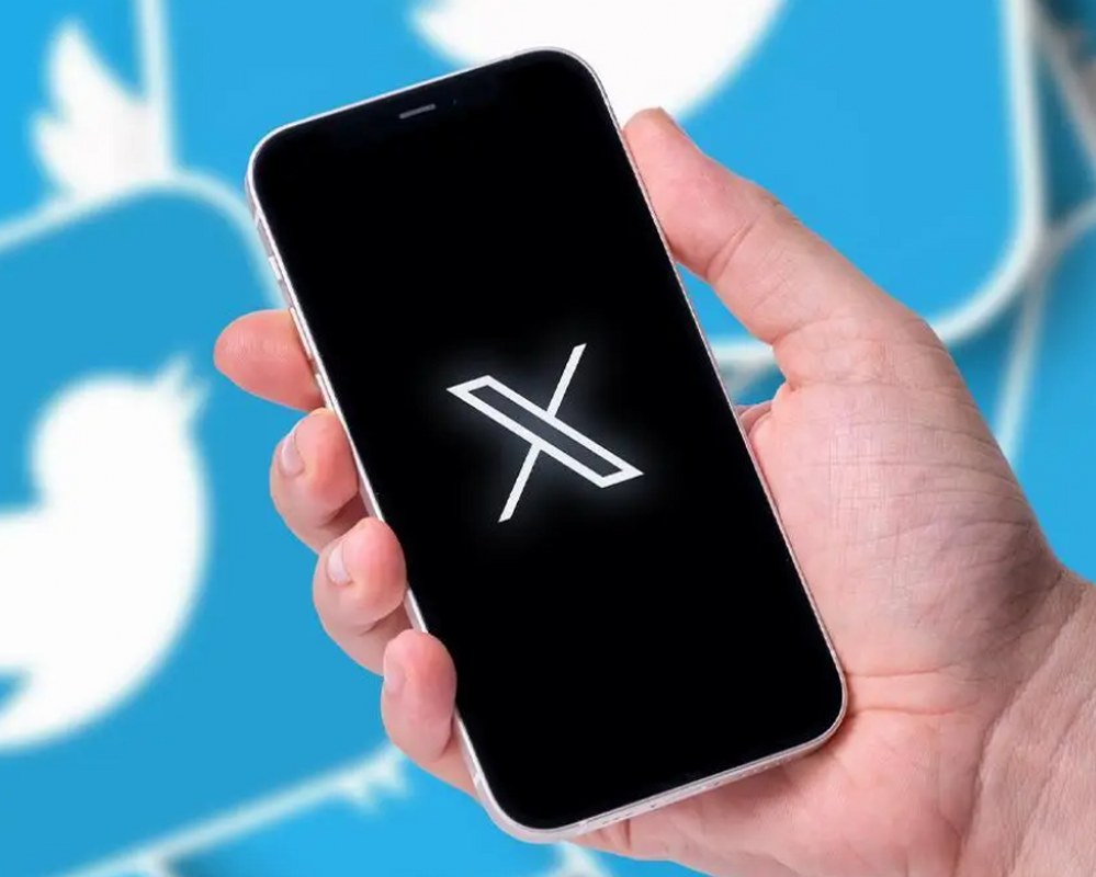 X, formally Twitter, logo in a mobile phone.