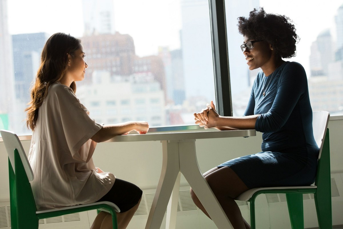 A female interviewer is conducting an interview with a customer.