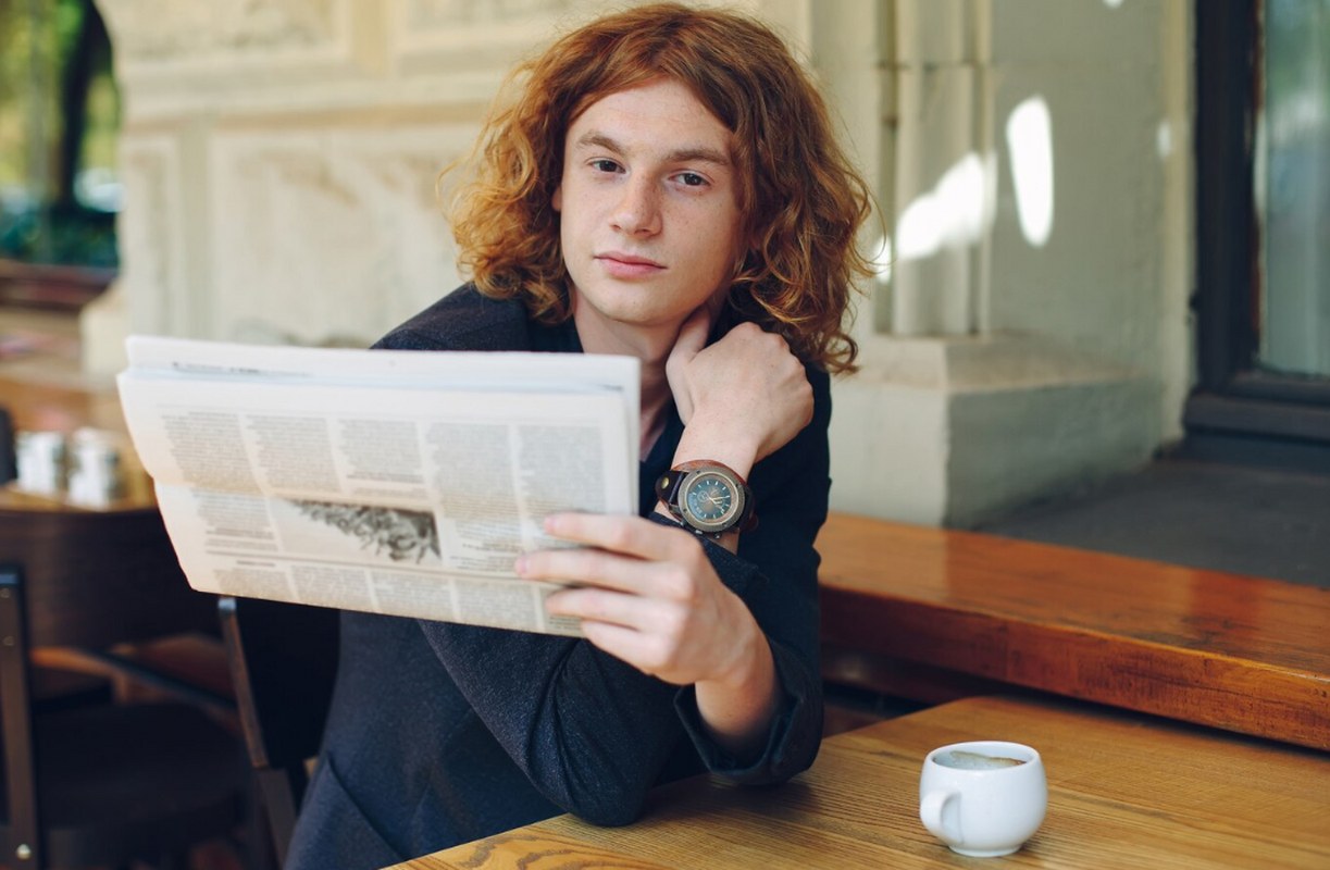 A man reading a newspaper.