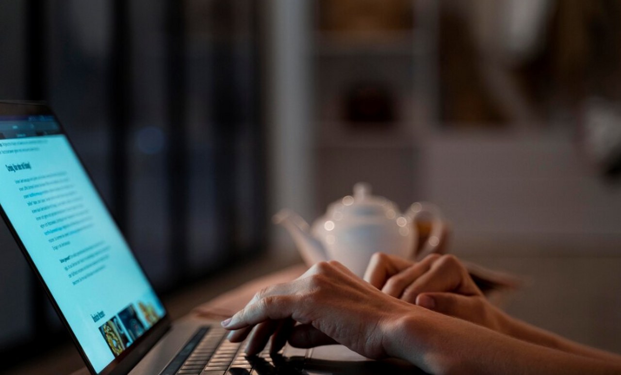 A man reading emails.