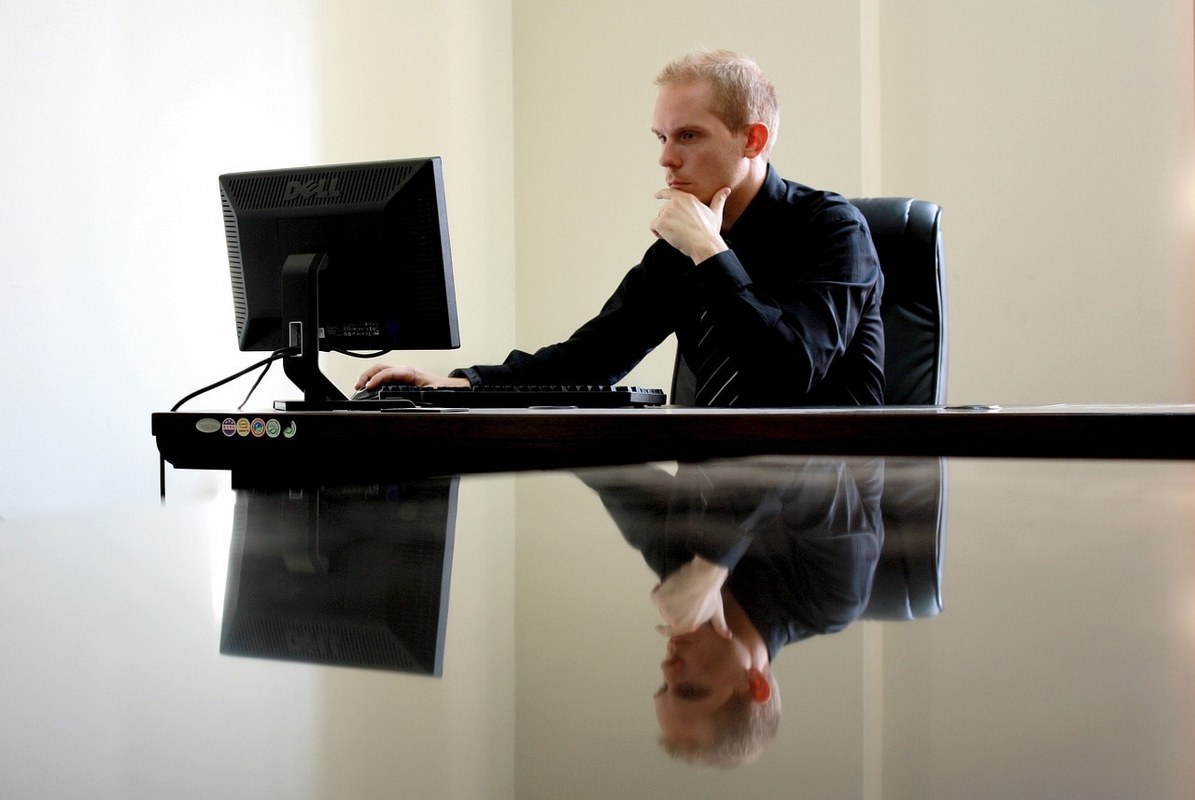 A man working on his desk.