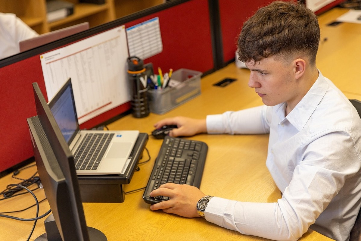 A man working on his laptop.