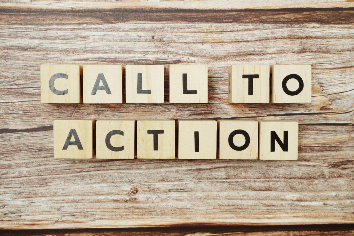 Call to Action alphabet letter on wooden background.