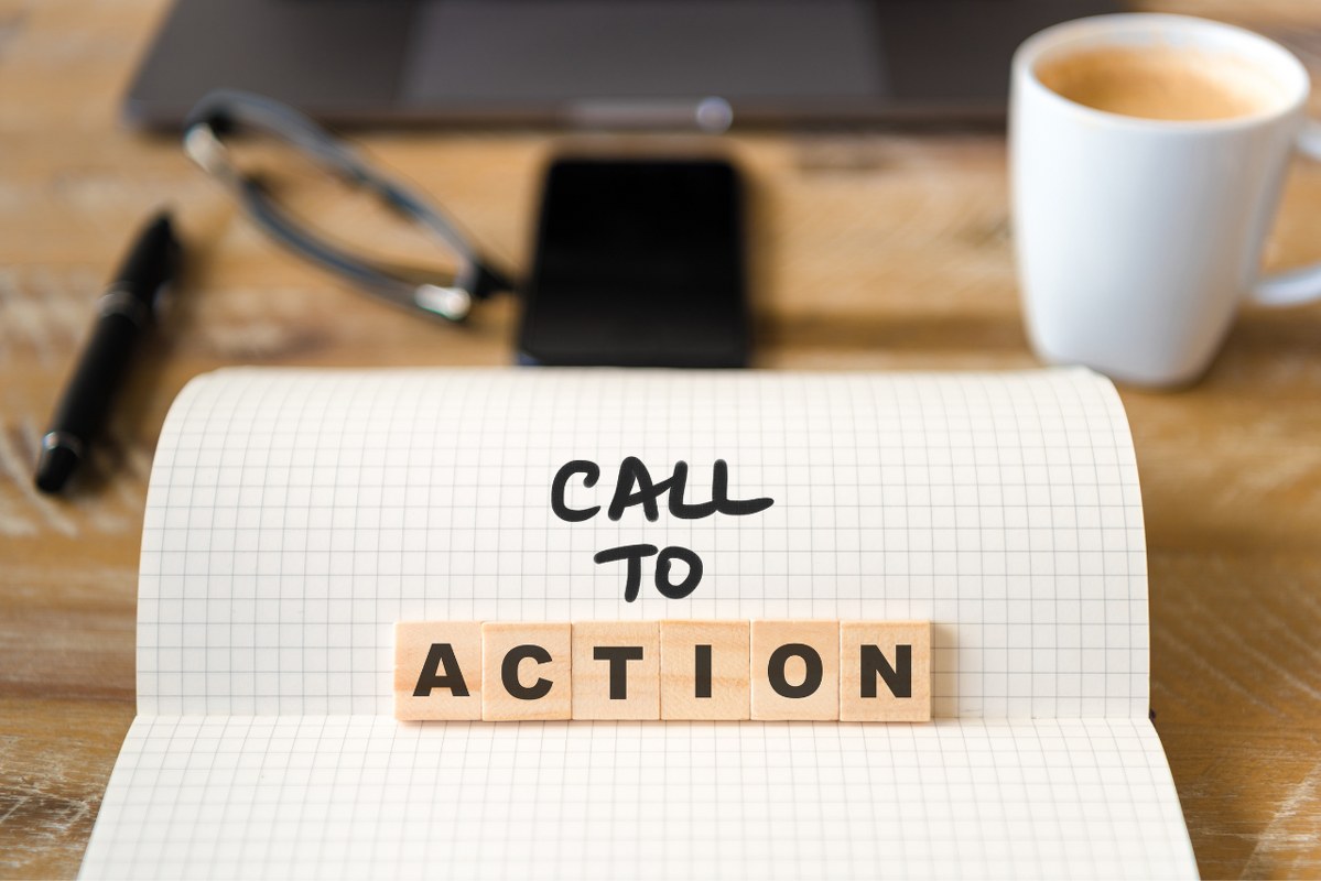 Call to action text on paper and tiles.