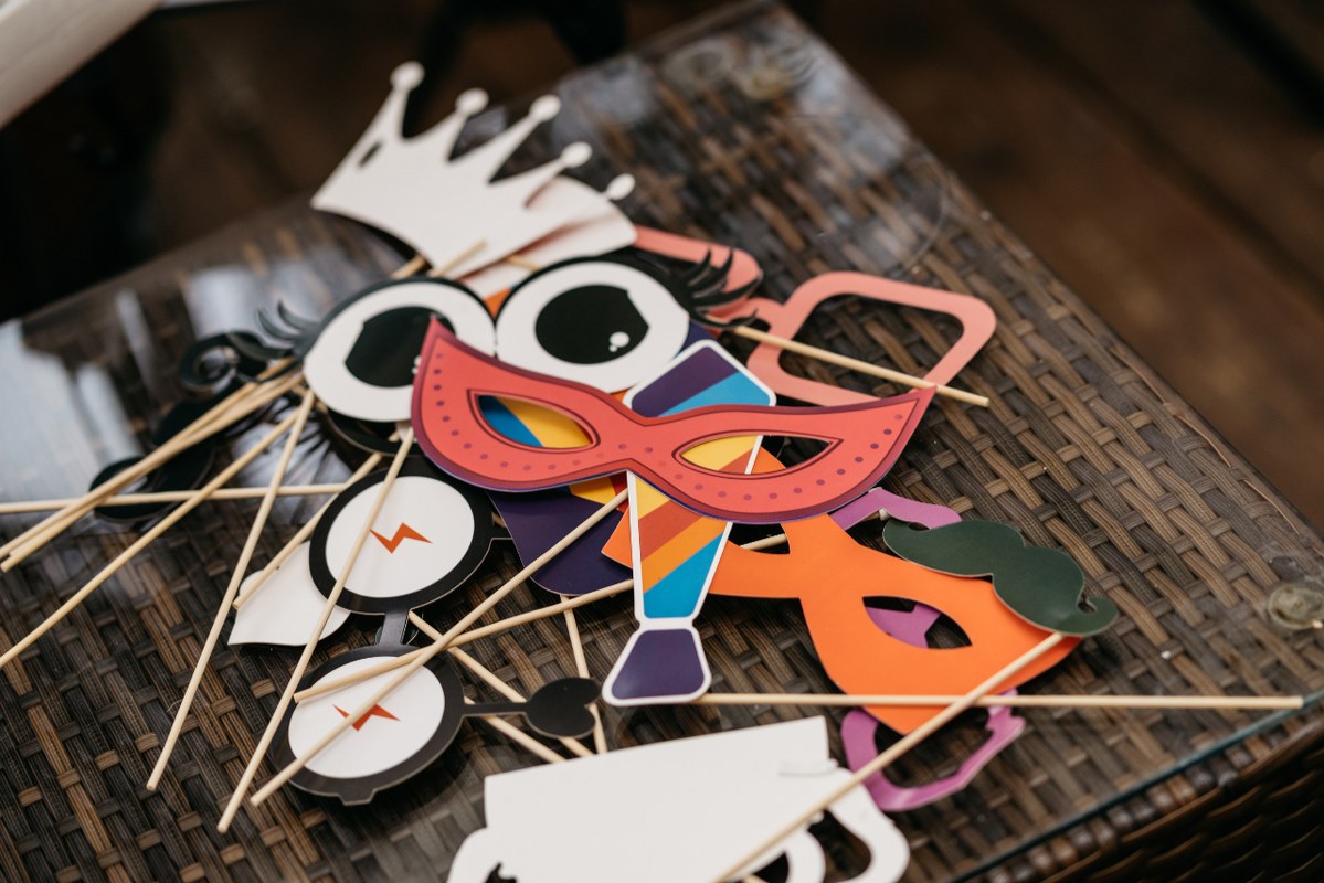Colorful photobooth props lying on a table.