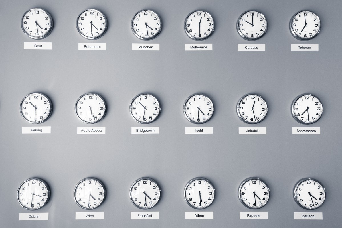 Different time zones displayed on clocks.