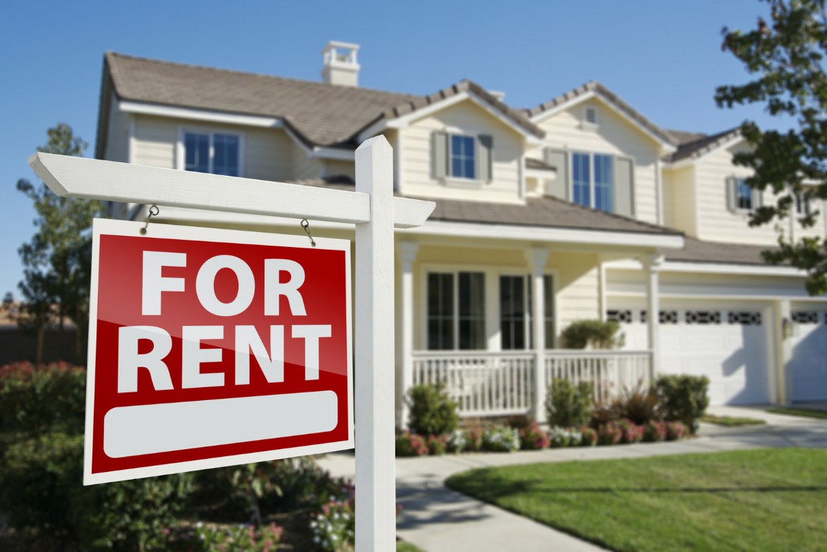 For rent Real Estate sign outside.