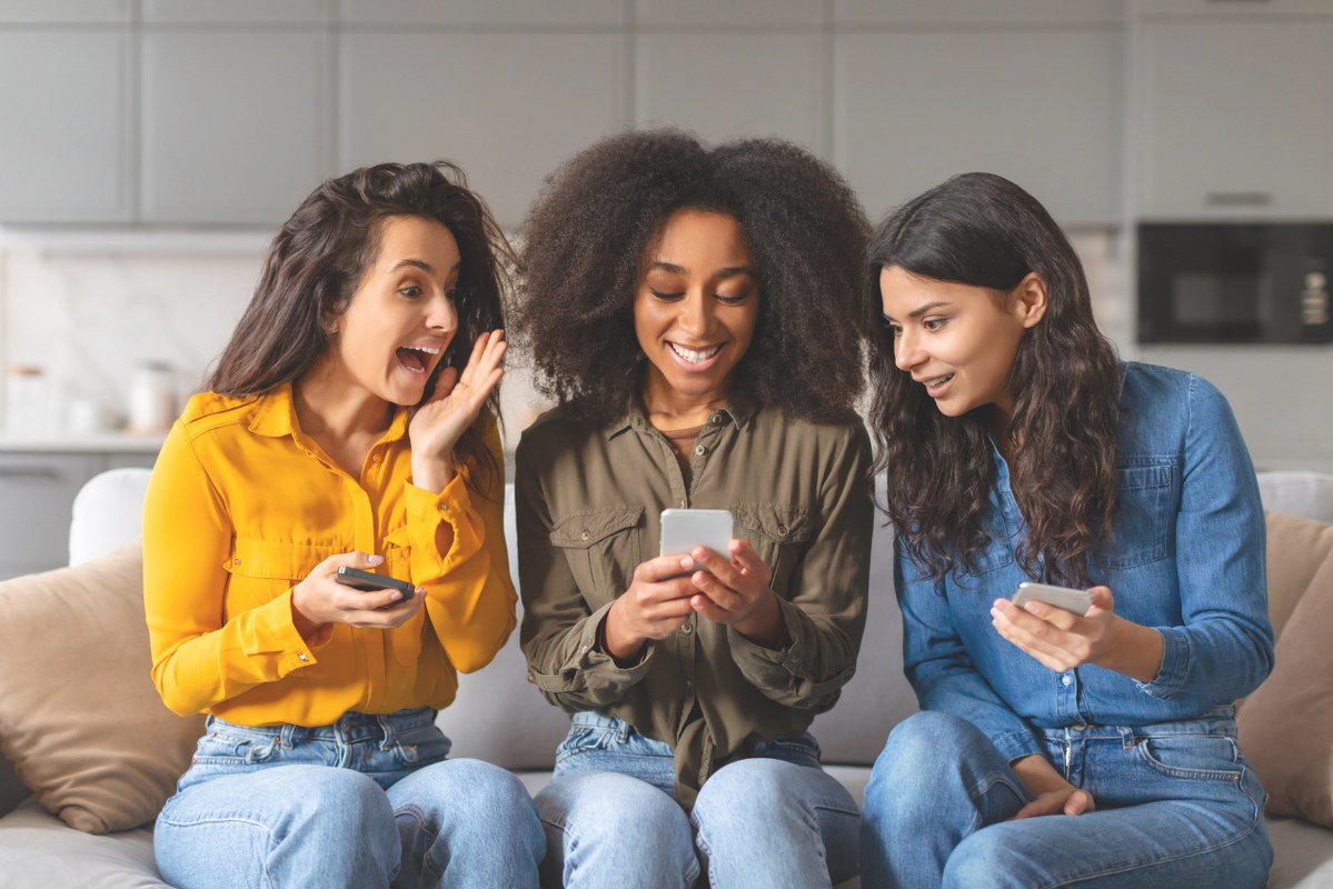 Friends engaged on content from phone.