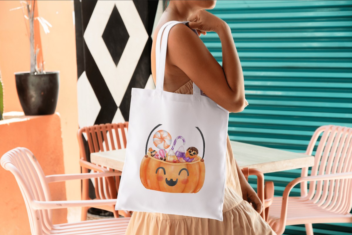 Halloween-themed Tote Bag worn by woman.