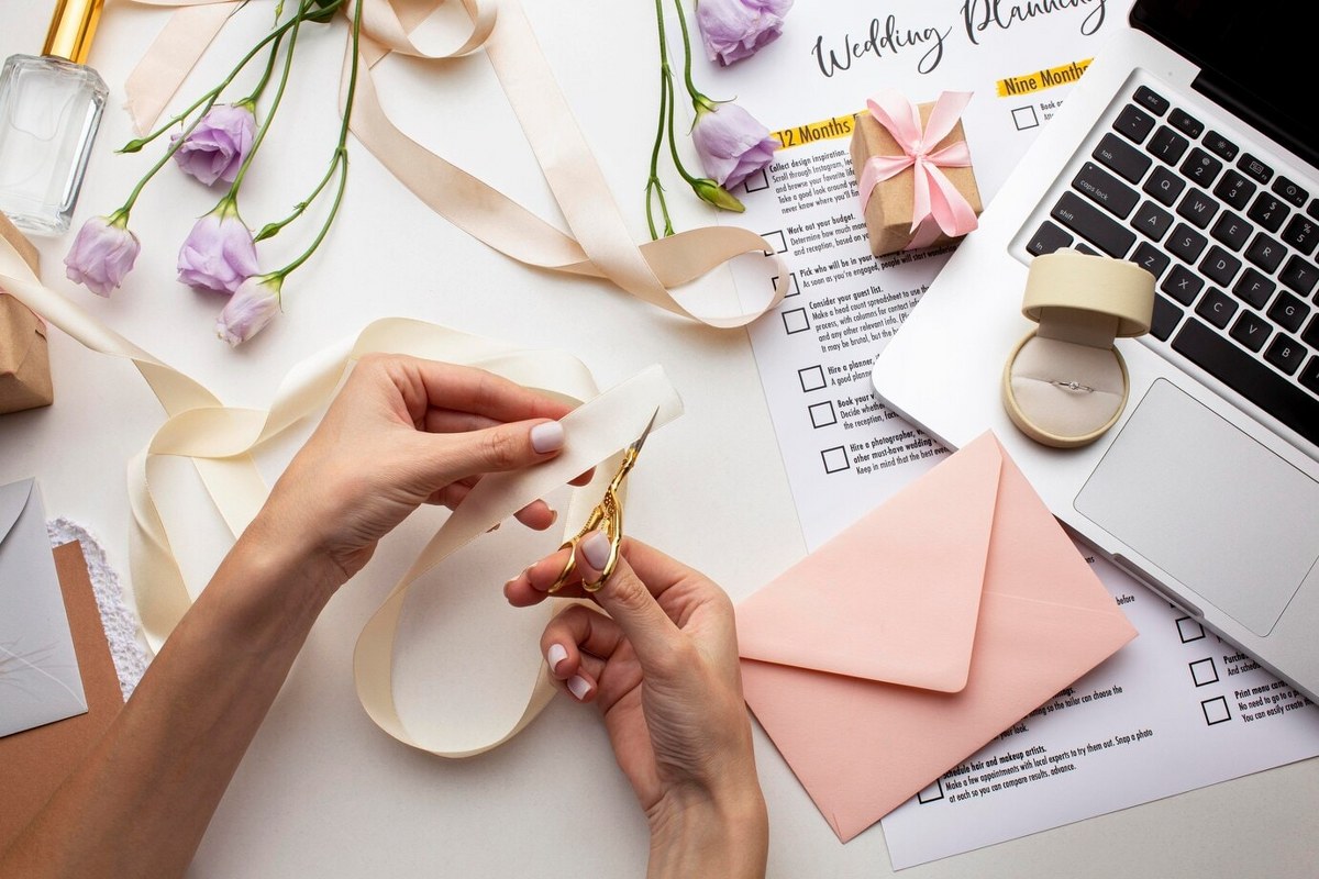 Hands creating handmade invitations.