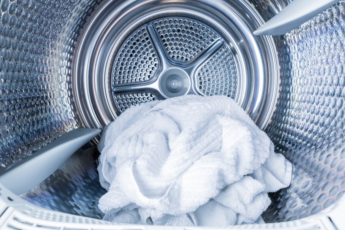 Inside of Tumble Dryer with Clean White Towels.