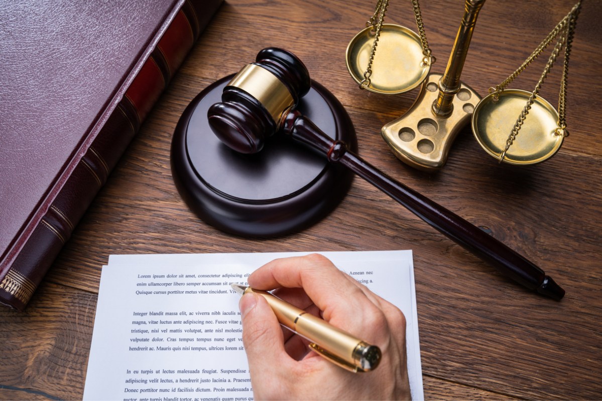 Judge Writing On Legal Documents.