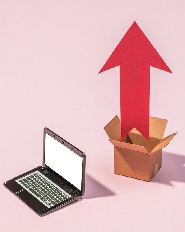 Laptop, box and arrow arrangement.