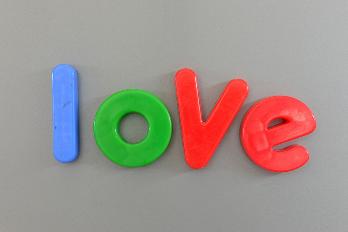 Magnet letters forming word love.