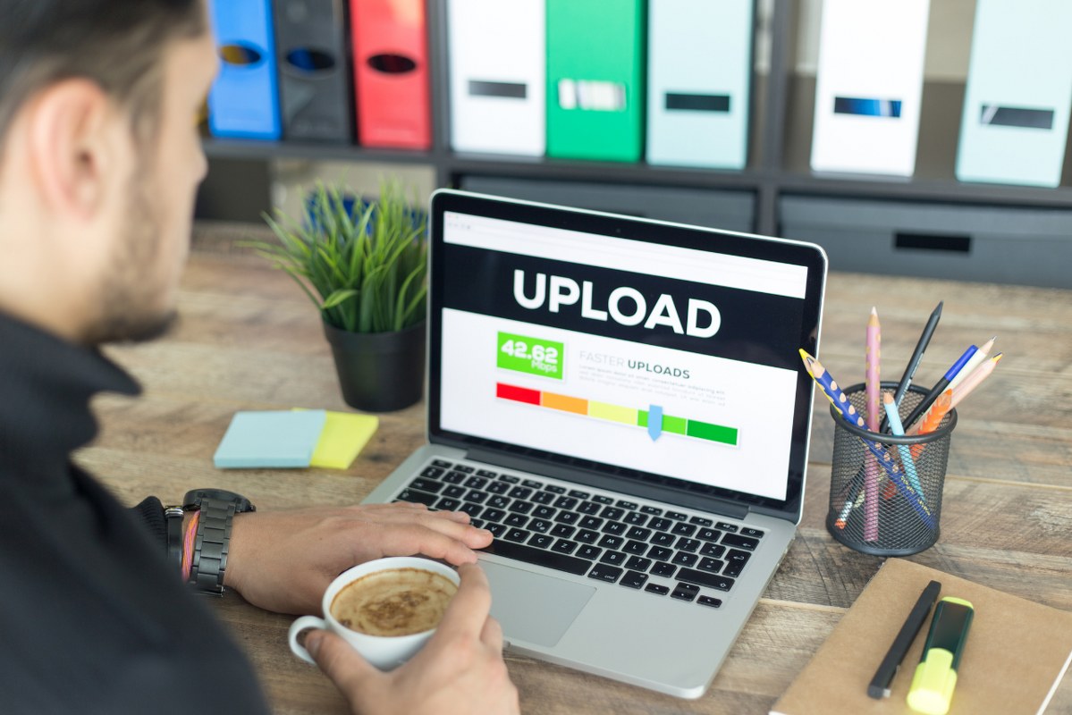 Man uploading video to website.