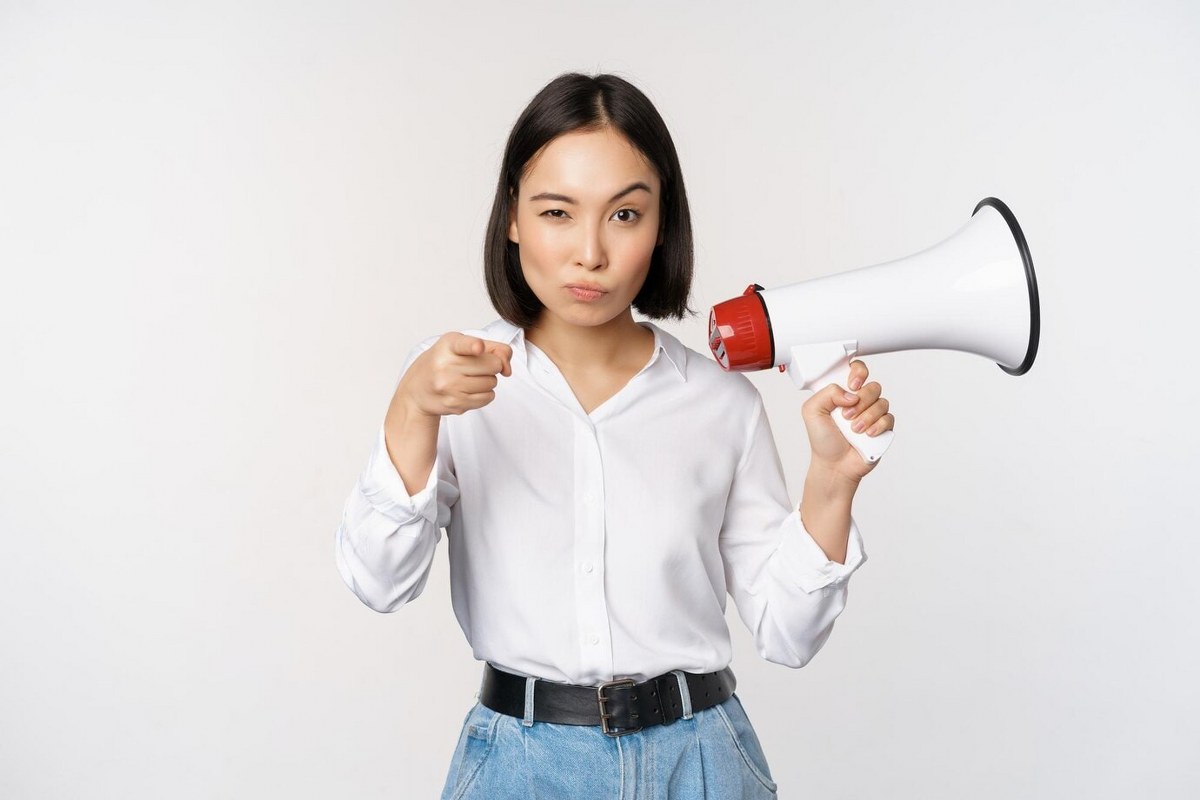 Modern asian woman with megaphone.
