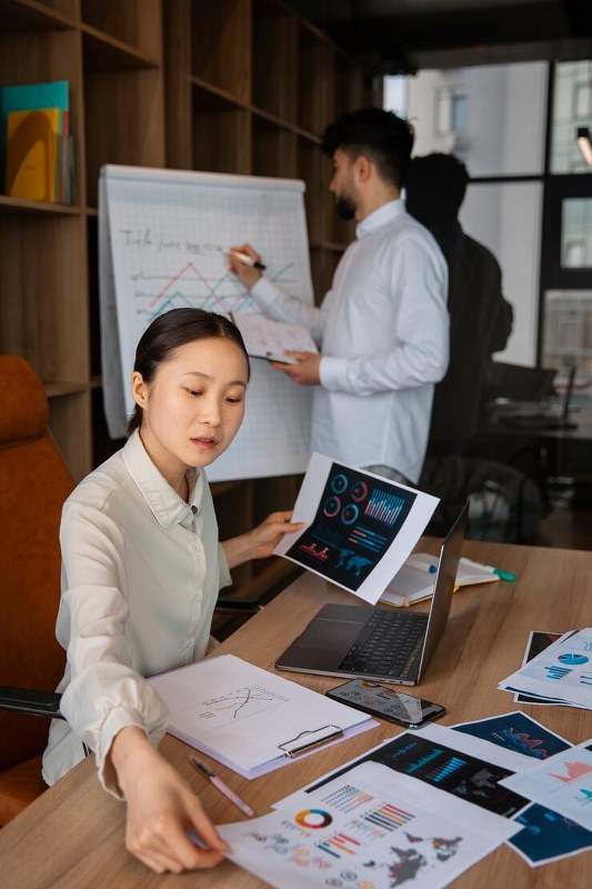Office workers using graphs.