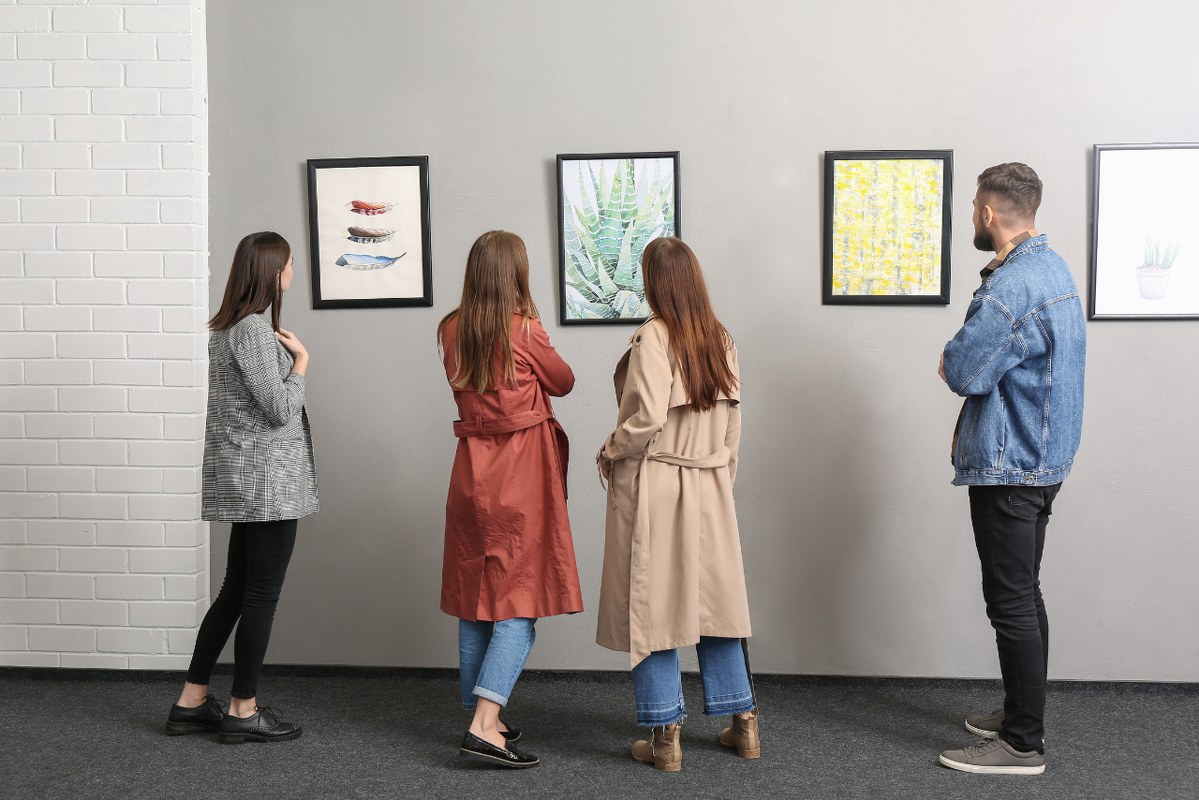 People at Exhibition in Modern Art Gallery.