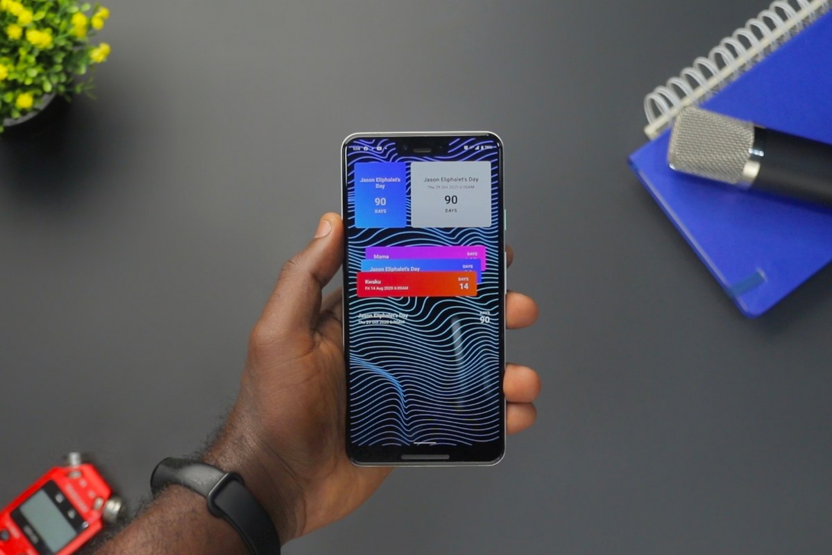 Person Holding Black Android Smartphone with notifications showing.