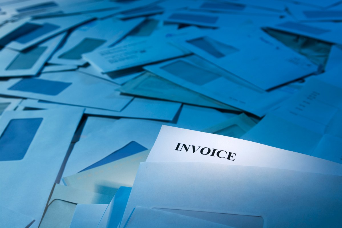 Pila of unpaid Invoices.