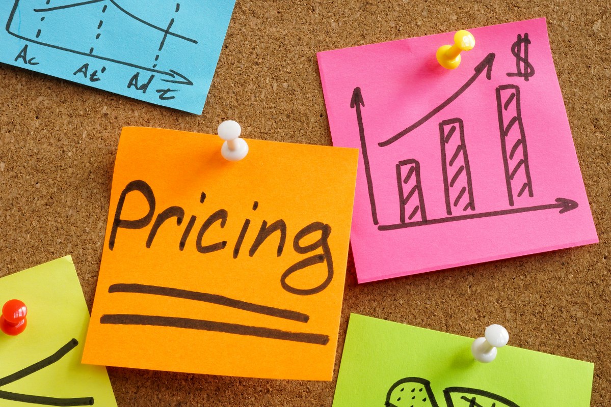 Pricing word on sticky note.