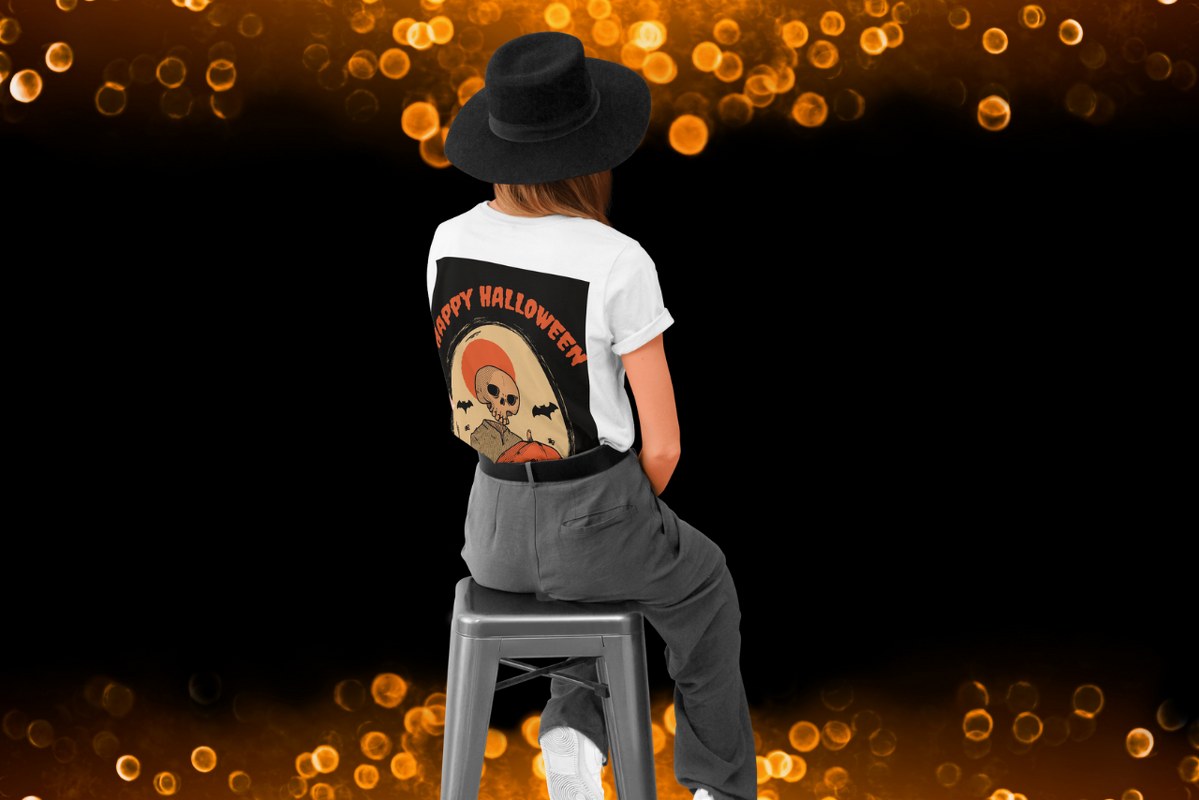 Rearview of woman with halloween-themed design shirt.