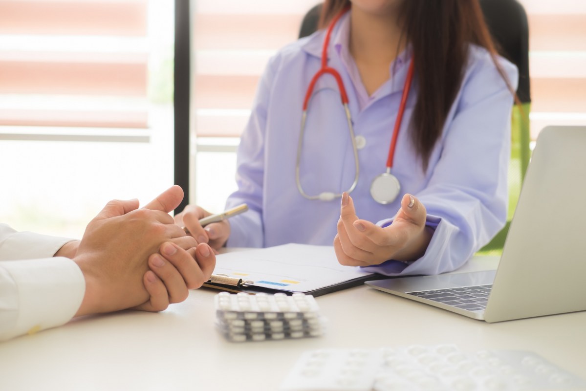 Sample of Professional service: doctor talking to patient.