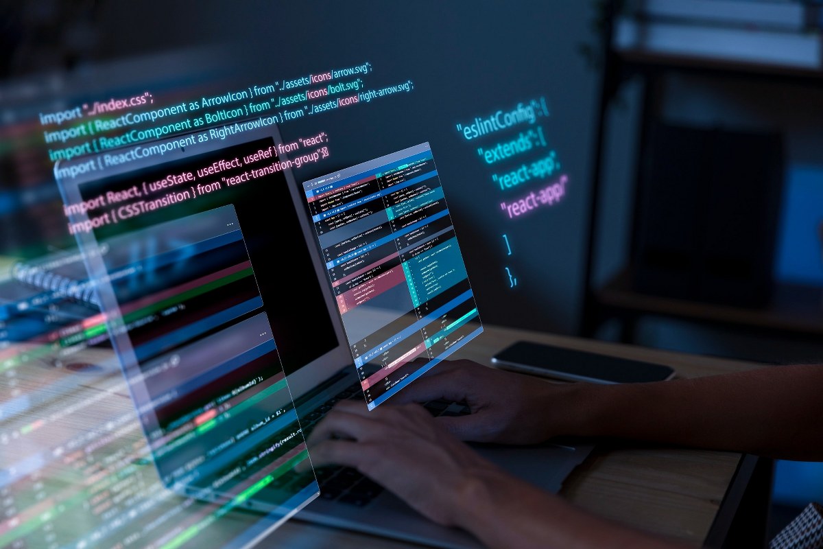 The person working with codes on a computer.