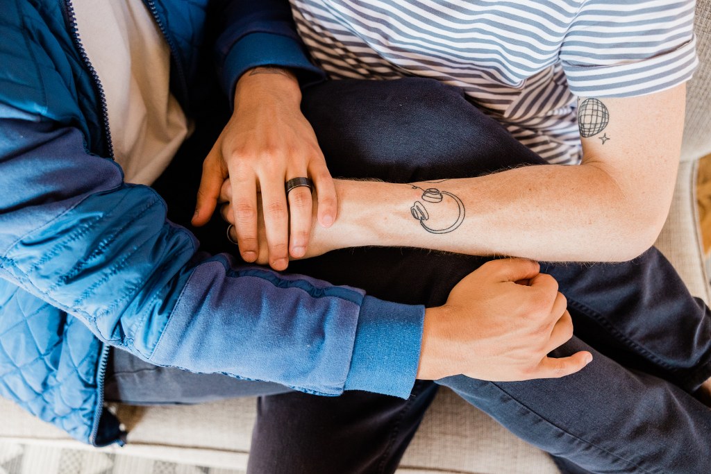 Top View of Couple Cuddling on Couch.