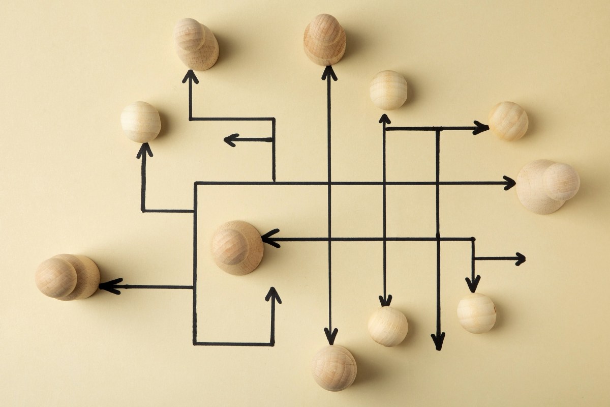 Top view wooden pawns arrangement.