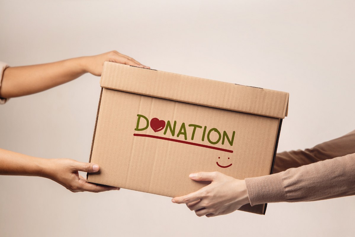 Volunteer Giving a Box.