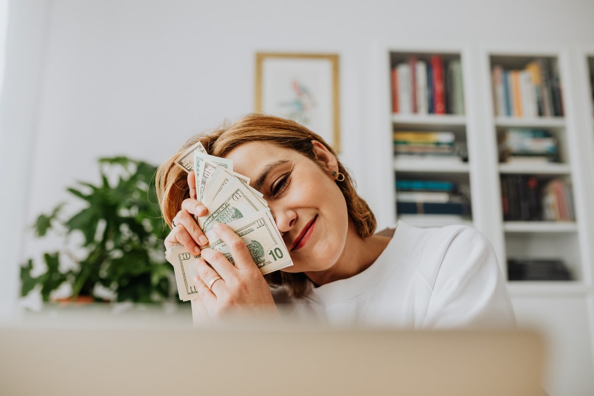 Woman Embracing Money.