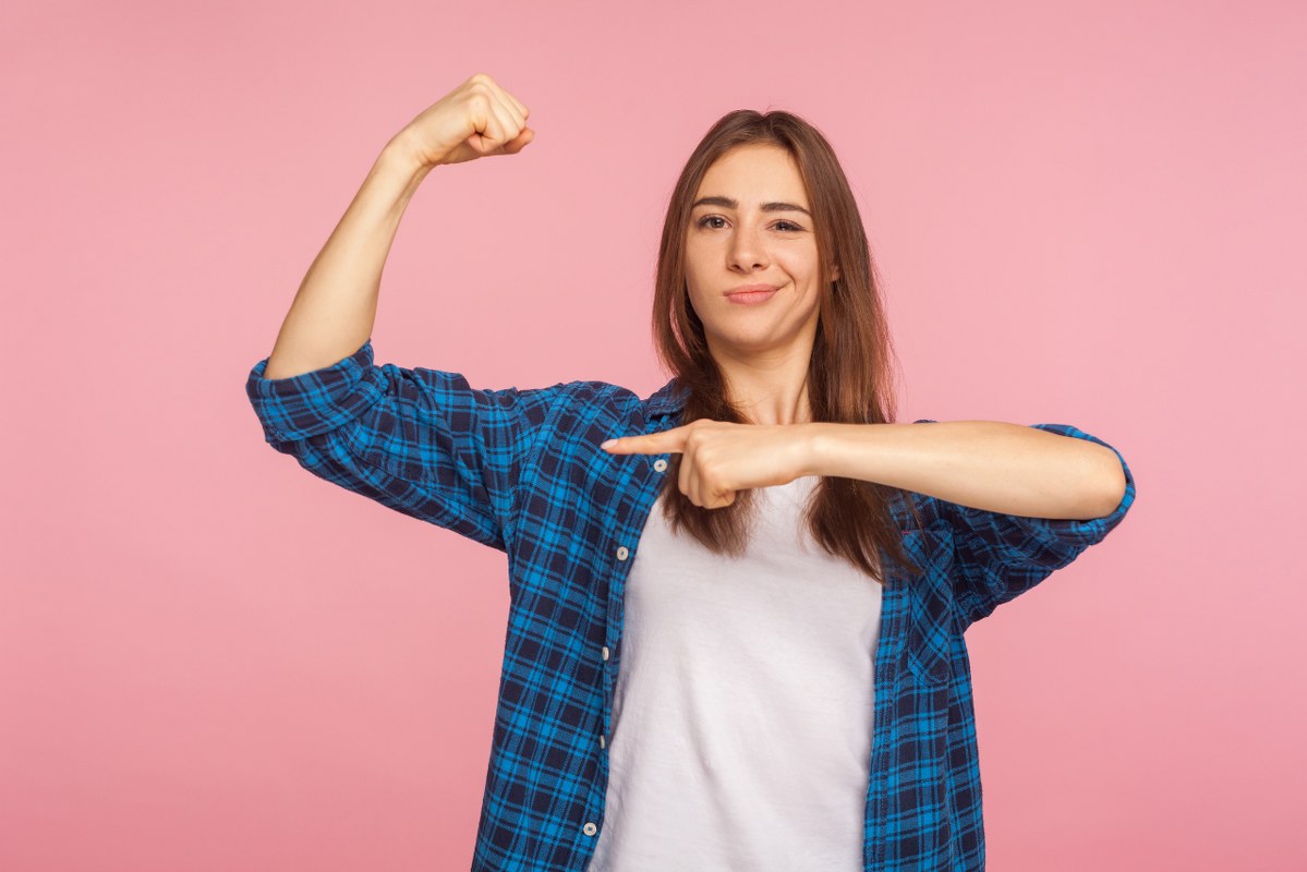 Woman Flexing Muscles.