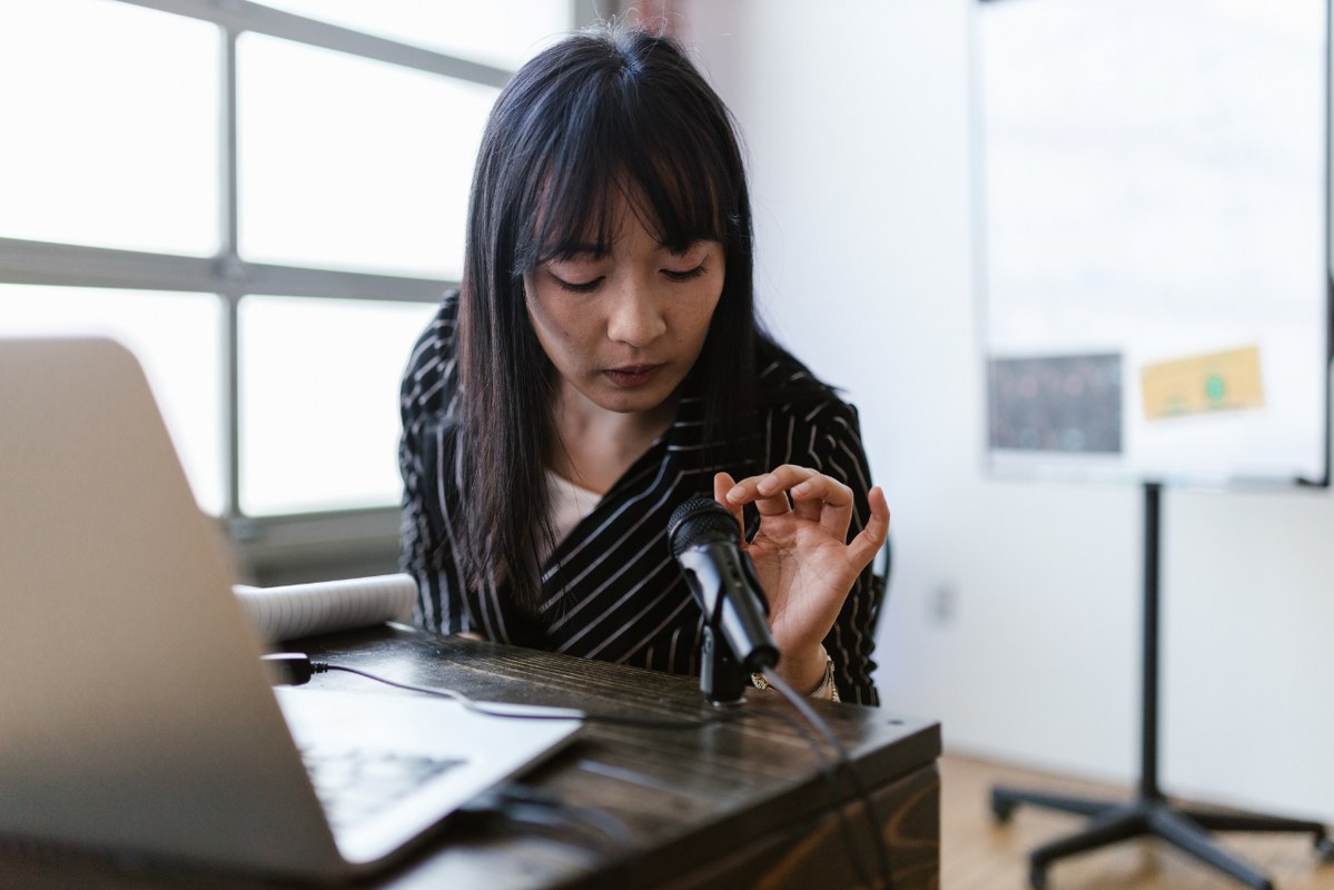Woman Testing the Microphone.