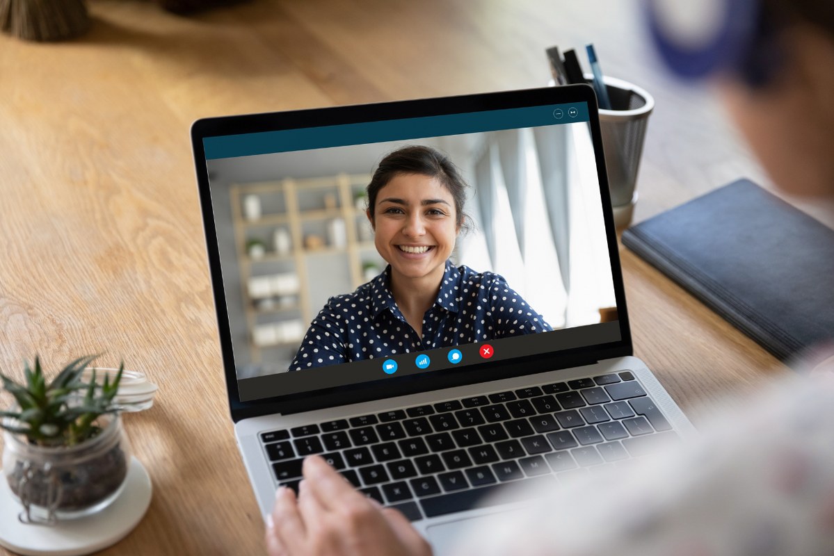 Woman is having a webcam meeting with international client.