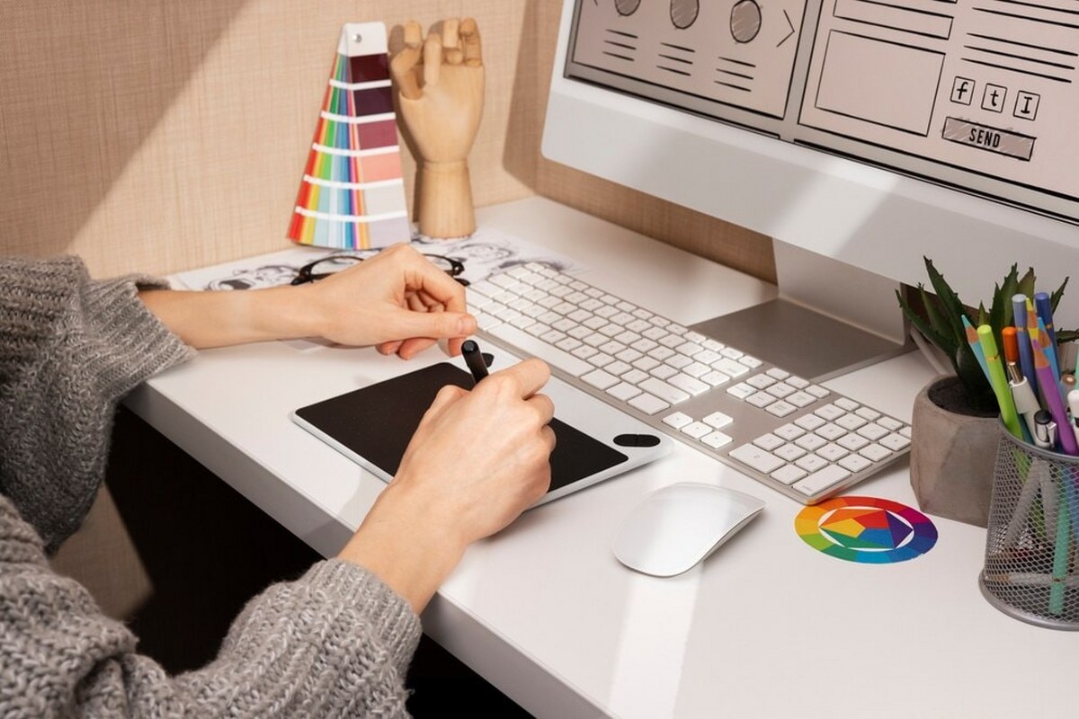Woman is working on a design board.